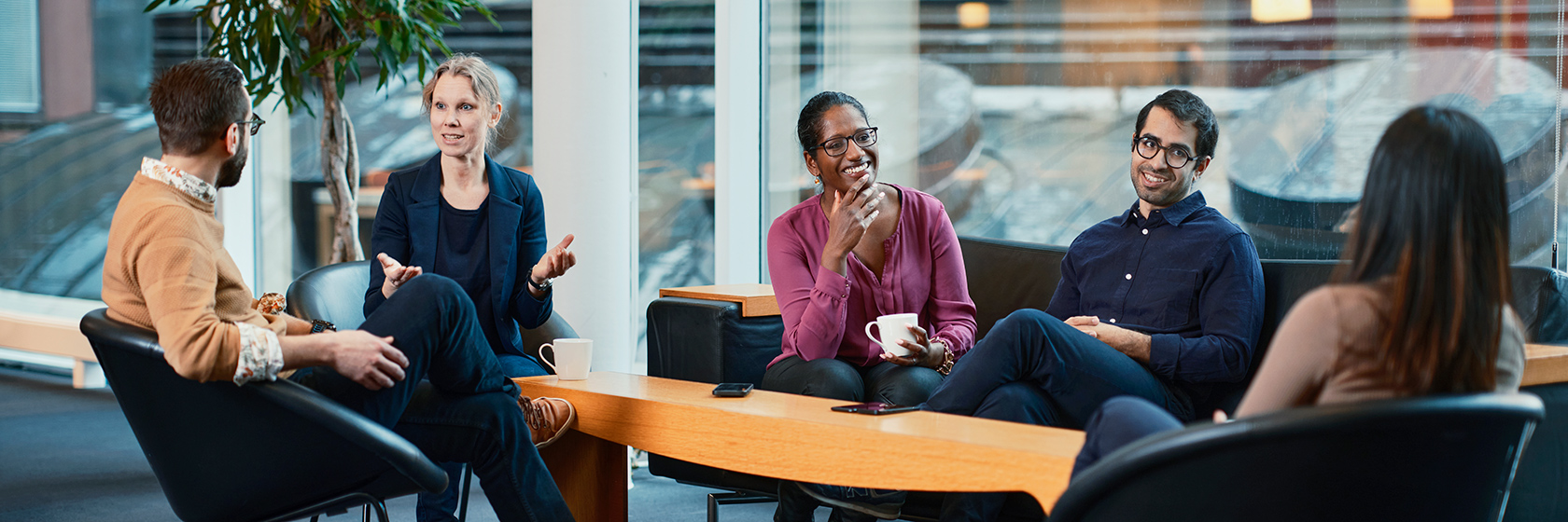 A group of people sitting and talking